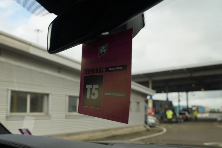 Hanger with boarding information on car mirror